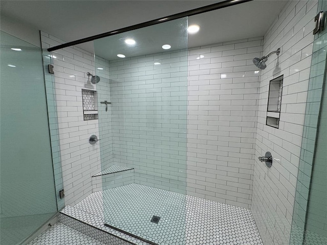 bathroom with a shower with shower door