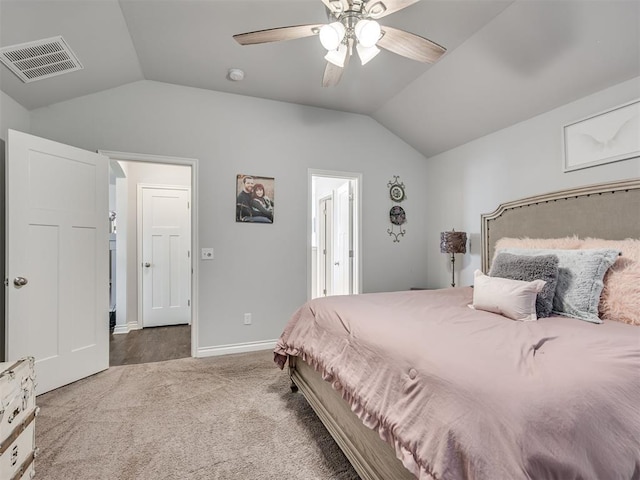 carpeted bedroom with ceiling fan and lofted ceiling