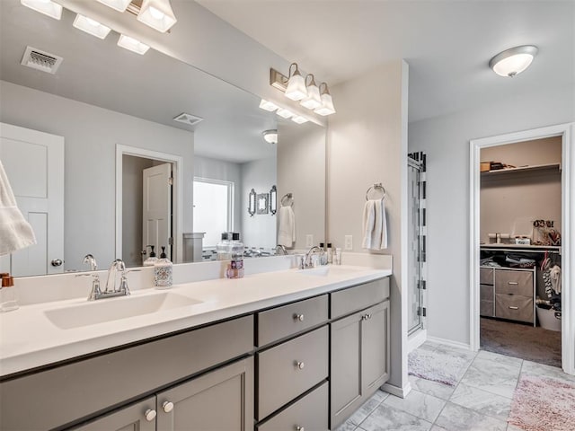 bathroom featuring vanity and an enclosed shower