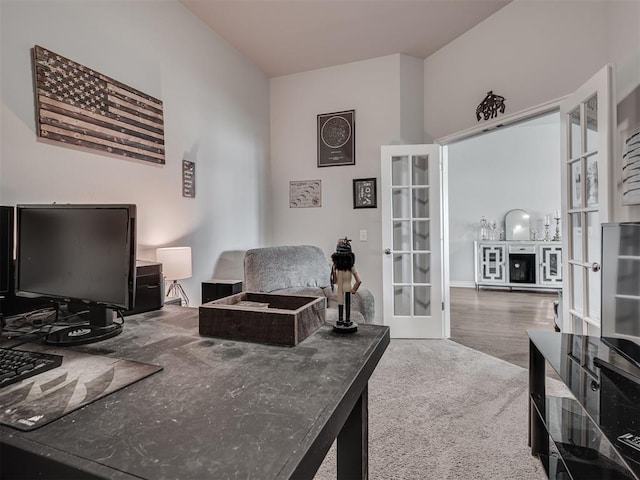 office area with french doors and hardwood / wood-style floors