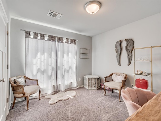 living area featuring carpet flooring