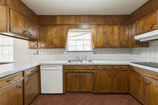 kitchen with tile countertops, sink, white dishwasher, and dark hardwood / wood-style floors