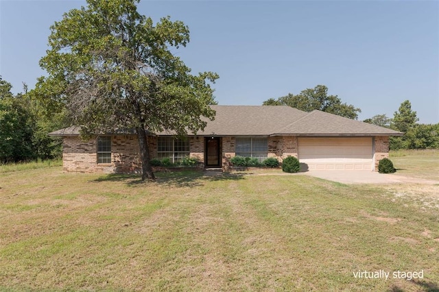 single story home with a front yard and a garage