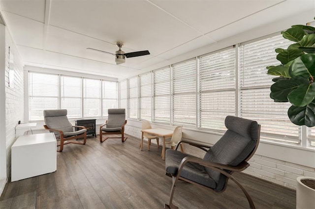 sunroom / solarium with a wealth of natural light and ceiling fan