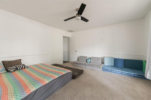 bedroom with ceiling fan and light colored carpet