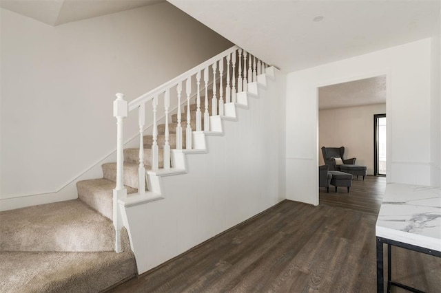 stairway featuring hardwood / wood-style floors