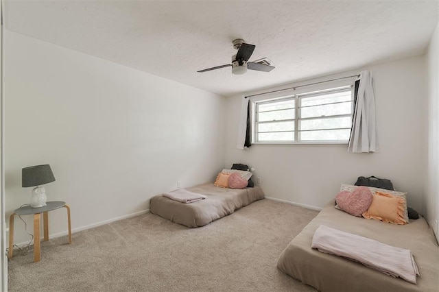 sitting room with light carpet and ceiling fan