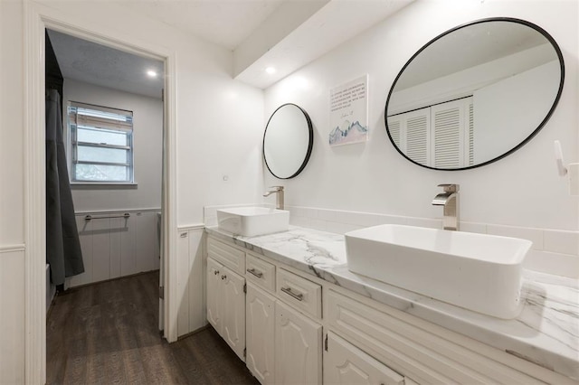 bathroom with vanity and wood-type flooring