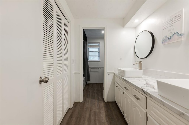 bathroom featuring vanity and wood-type flooring