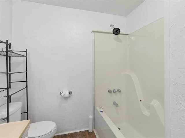 full bathroom with hardwood / wood-style floors, vanity, toilet, and shower / bathing tub combination