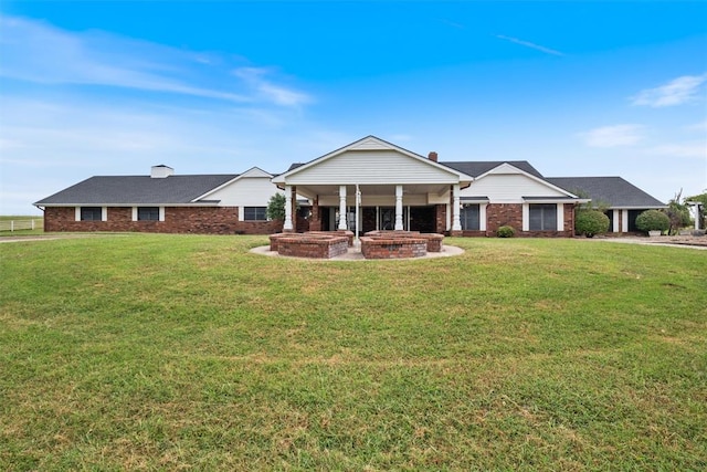 ranch-style home with a front yard