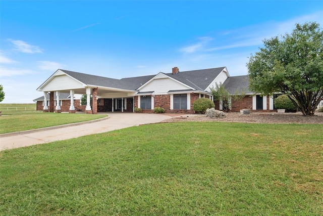 ranch-style home with a carport and a front yard