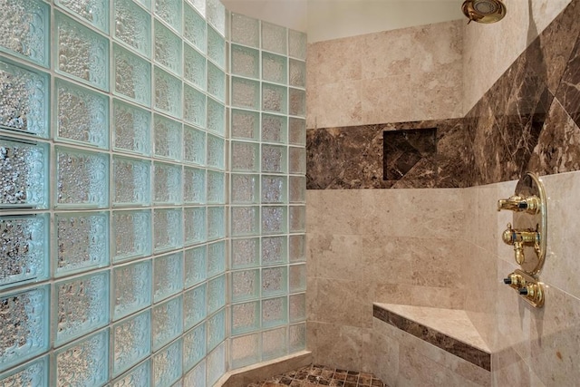 bathroom with a tile shower