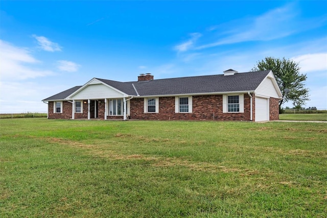 ranch-style house with a garage and a front yard