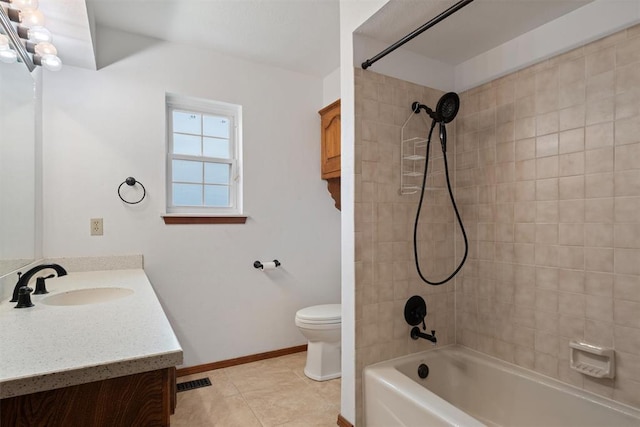 full bathroom with vanity, tile patterned floors, toilet, and tiled shower / bath