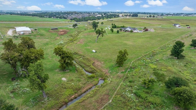 birds eye view of property featuring a rural view