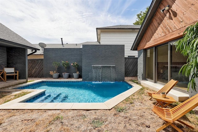 view of swimming pool featuring a patio area, a fenced in pool, and a fenced backyard