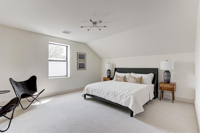 bedroom featuring visible vents, light colored carpet, baseboards, and vaulted ceiling