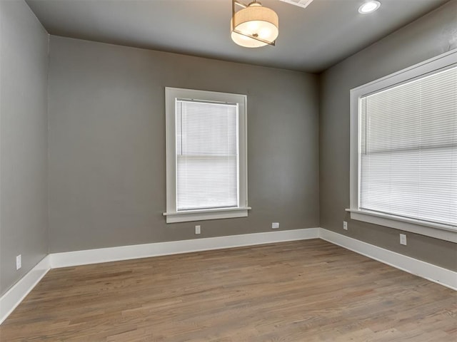 spare room with light hardwood / wood-style floors