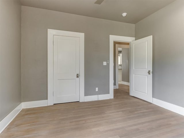 unfurnished bedroom with light wood-type flooring