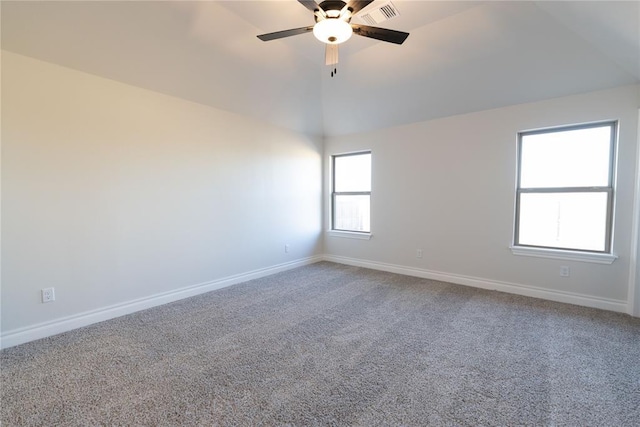 carpeted empty room featuring lofted ceiling and ceiling fan