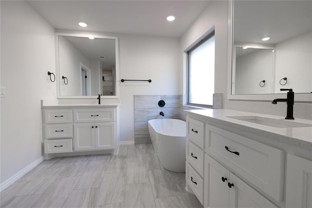 bathroom featuring a bathtub and vanity