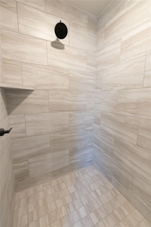 bathroom with tiled shower