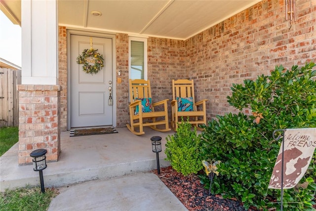 entrance to property featuring a porch