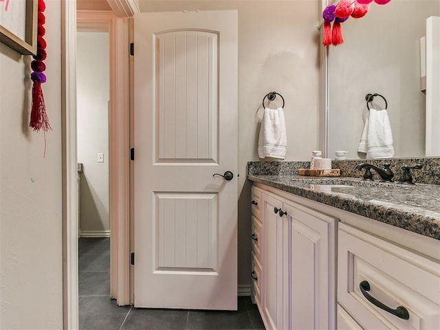 bathroom featuring tile patterned flooring and vanity