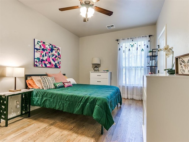 bedroom with light wood-type flooring and ceiling fan