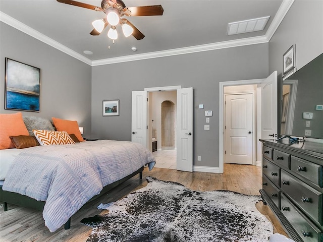 bedroom featuring ceiling fan, ornamental molding, and light wood-type flooring