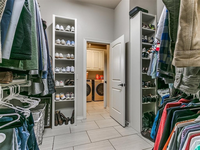 spacious closet with washing machine and clothes dryer