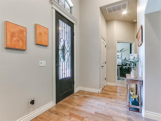 foyer entrance featuring light hardwood / wood-style flooring