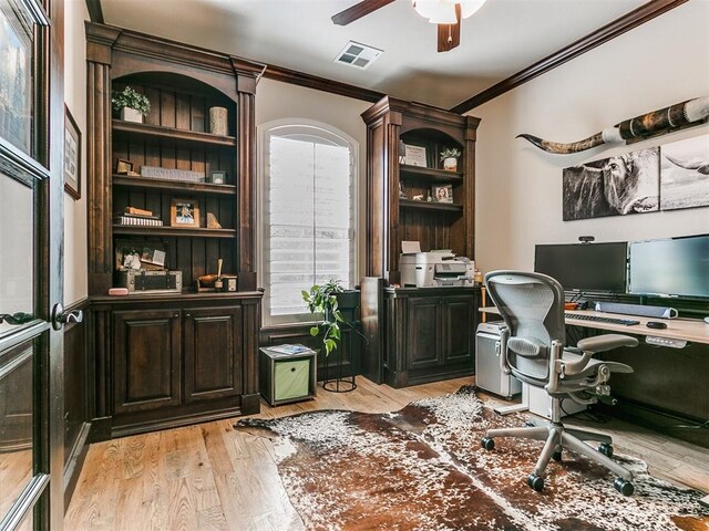 home office featuring plenty of natural light, ceiling fan, light wood-type flooring, and crown molding