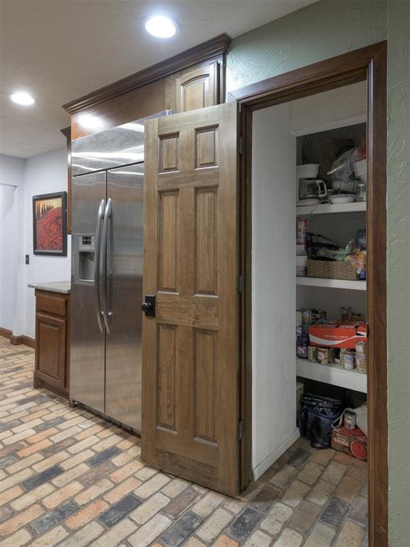 kitchen with stainless steel fridge with ice dispenser