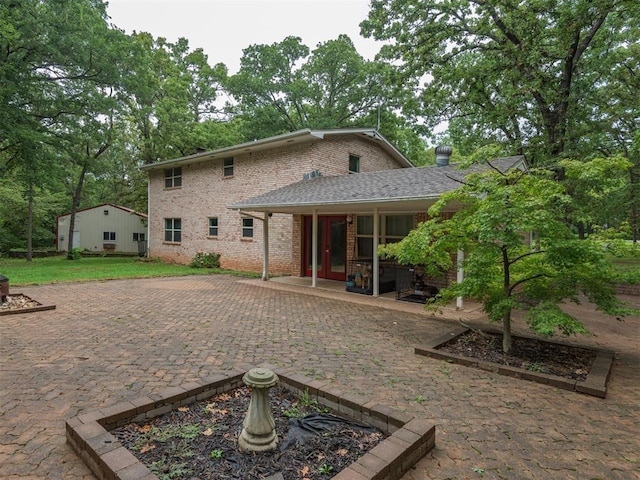 rear view of property with a patio area