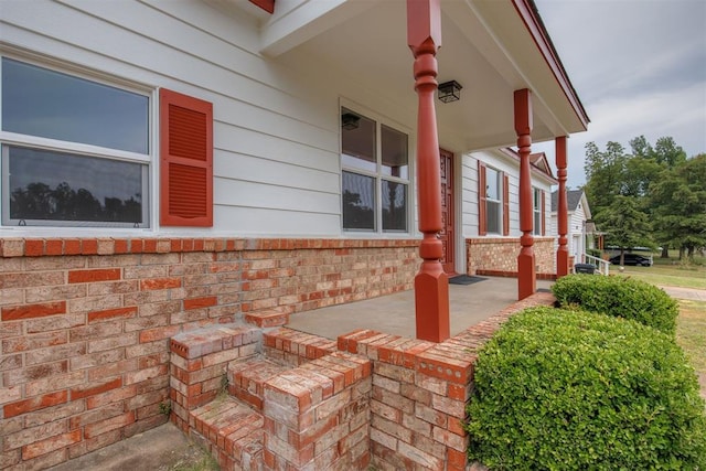 view of side of property featuring a porch