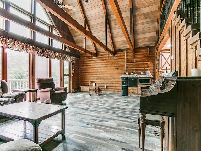 living room featuring wooden ceiling, high vaulted ceiling, hardwood / wood-style flooring, rustic walls, and beam ceiling