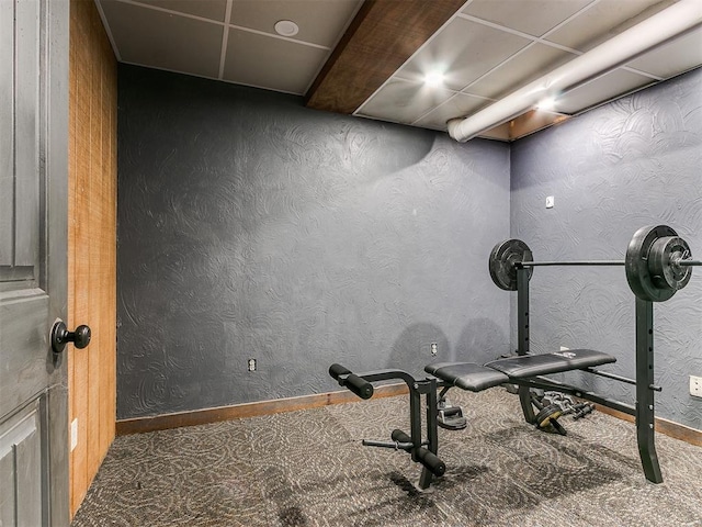 workout room with dark colored carpet