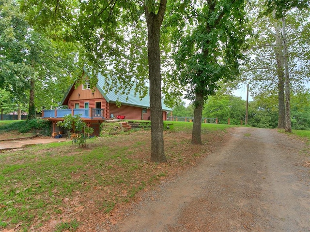 view of property exterior with a deck