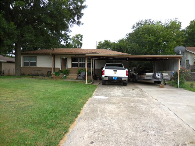 view of front of property with a front lawn and a carport