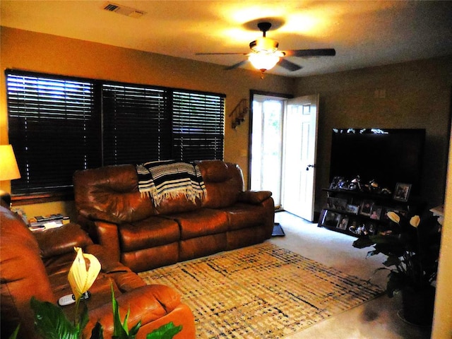 living room with carpet floors and ceiling fan