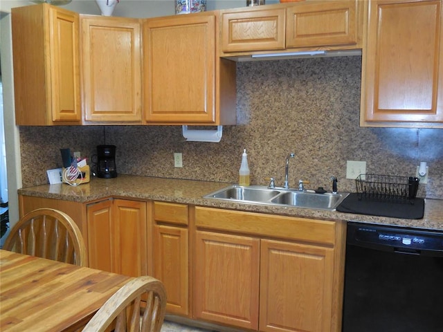 kitchen featuring decorative backsplash, sink, and black dishwasher