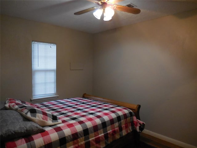 bedroom featuring hardwood / wood-style flooring and ceiling fan