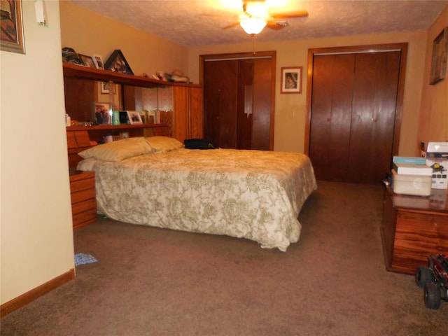 carpeted bedroom with multiple closets and ceiling fan