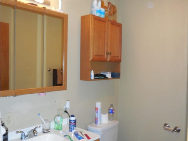 bathroom featuring sink and toilet