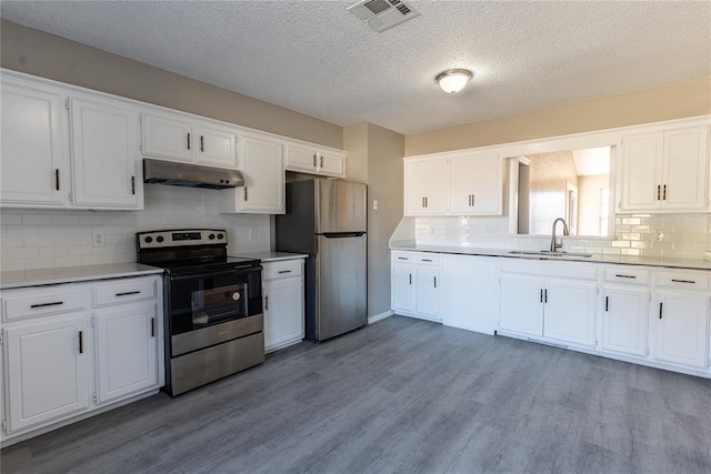 kitchen featuring sink, white cabinets, and appliances with stainless steel finishes