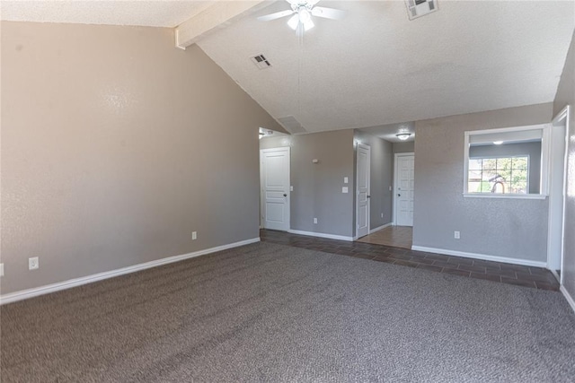 carpeted empty room with lofted ceiling with beams, ceiling fan, and a textured ceiling