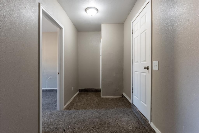 hall with dark carpet