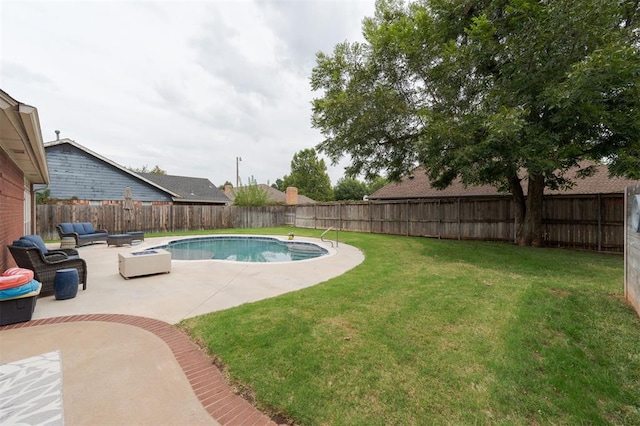 view of swimming pool featuring a yard, a patio, and an outdoor hangout area